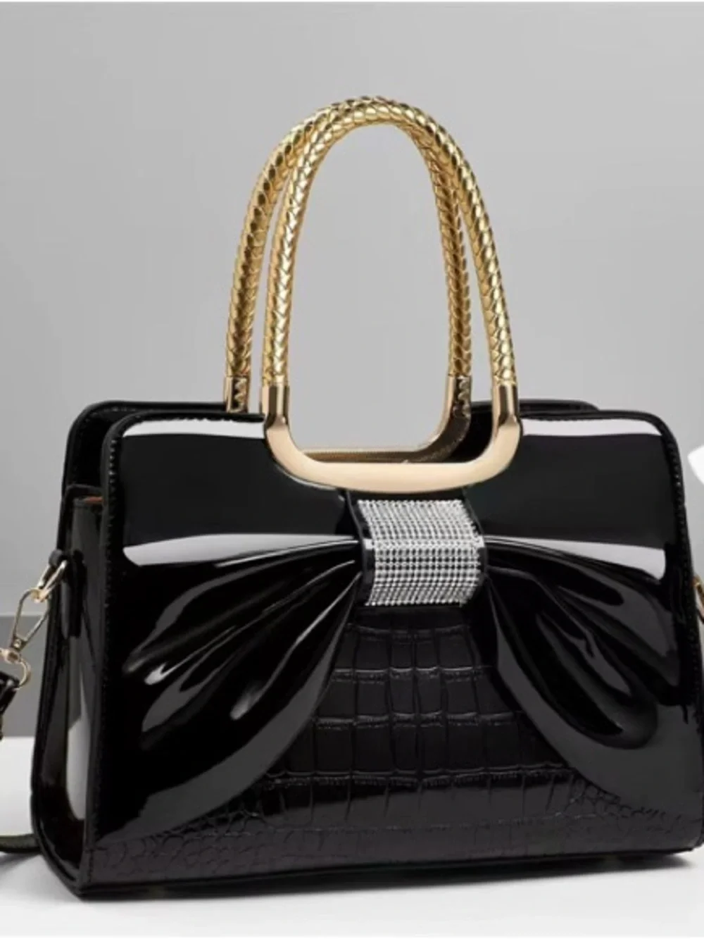 Elegant Black Patent Bow Handbag with Gold Handles